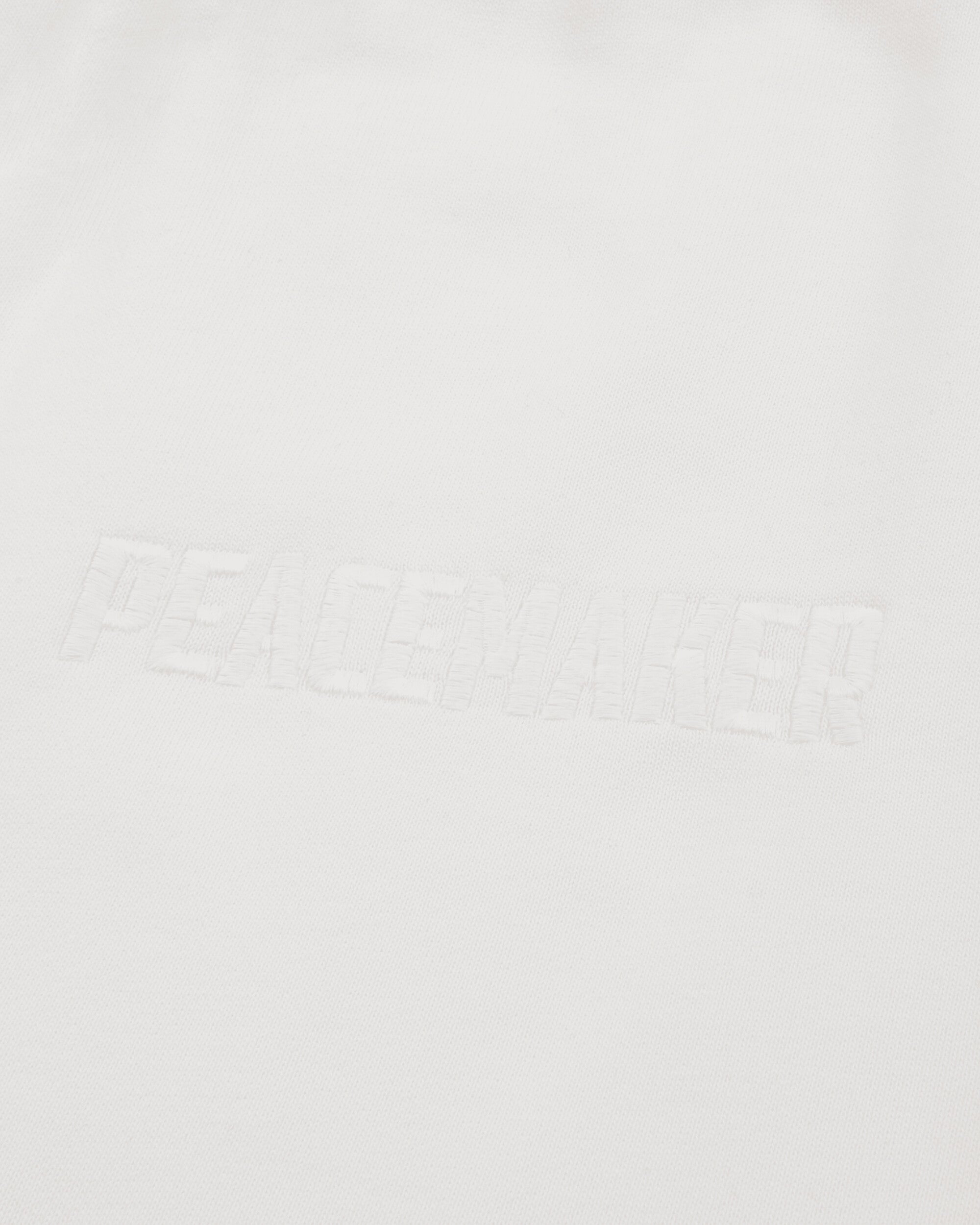OAMC Peacemaker Loose Fit Sweatpants Peacemaker Logo White Pants Sweatpants PCM2OW01PFT00201 01